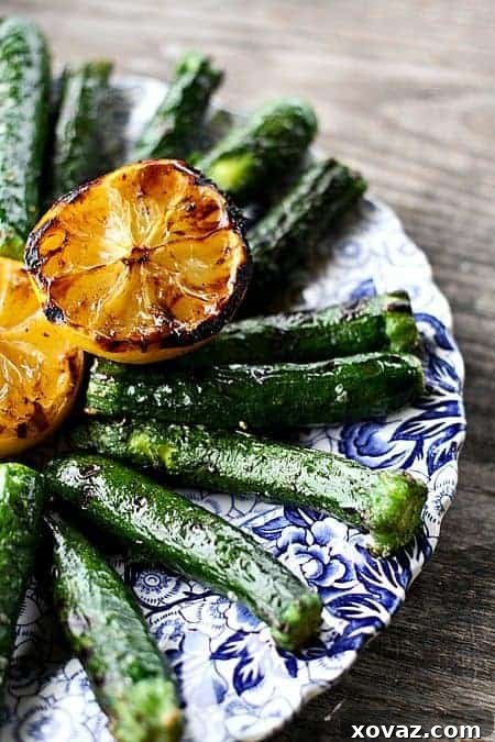 Close-up of Lemon Pepper Grilled Zucchini with char marks, ready to be served.