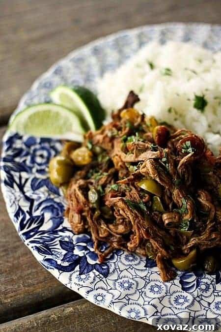 Fall-Apart Cuban Ropa Vieja: Instant Pot or Slow Cooker 4 Ropa Vieja: Thin shreds of flank steak braised in a rich tomato vegetable sauce with olives and capers. Prepare in an Instant Pot OR Slow-Cooker.