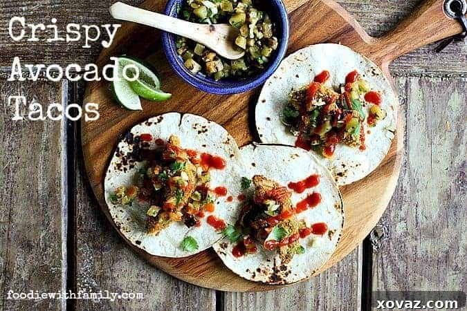 Golden Fried Avocado Tacos with Smoky Pineapple Relish 2 Delicious Crispy Avocado Tacos with bright Grilled Pineapple Relish, garnished with fresh cilantro.