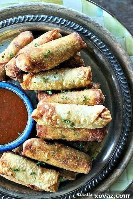 Crunchy egg roll wrappers encasing a rich, cheesy, bacon-studded barbecue chicken filling