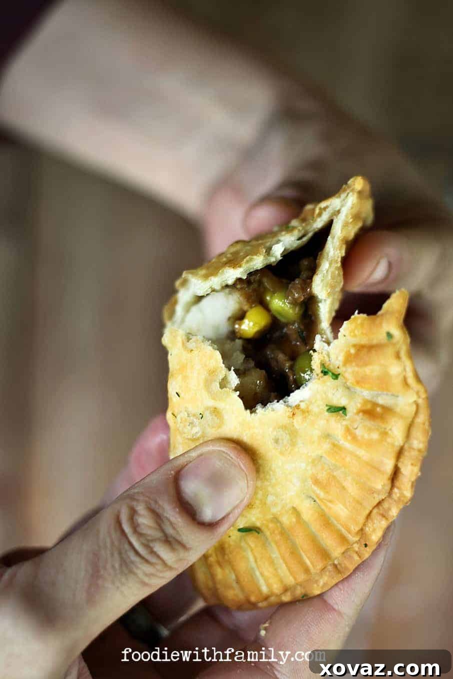 Shepherd's Pie Pockets 3 Baked Shepherd's Pie Empanadas on a baking sheet, featuring a lightly golden and firm crust, ready to be served.