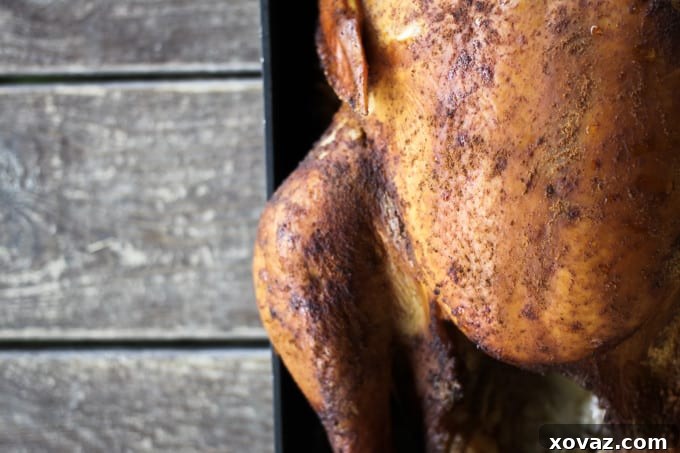 Smoked Turkey Perfection: Techniques for a Flavorful Feast 6 A smoked turkey cooking inside a Traeger pellet grill, showing the indirect heat setup.