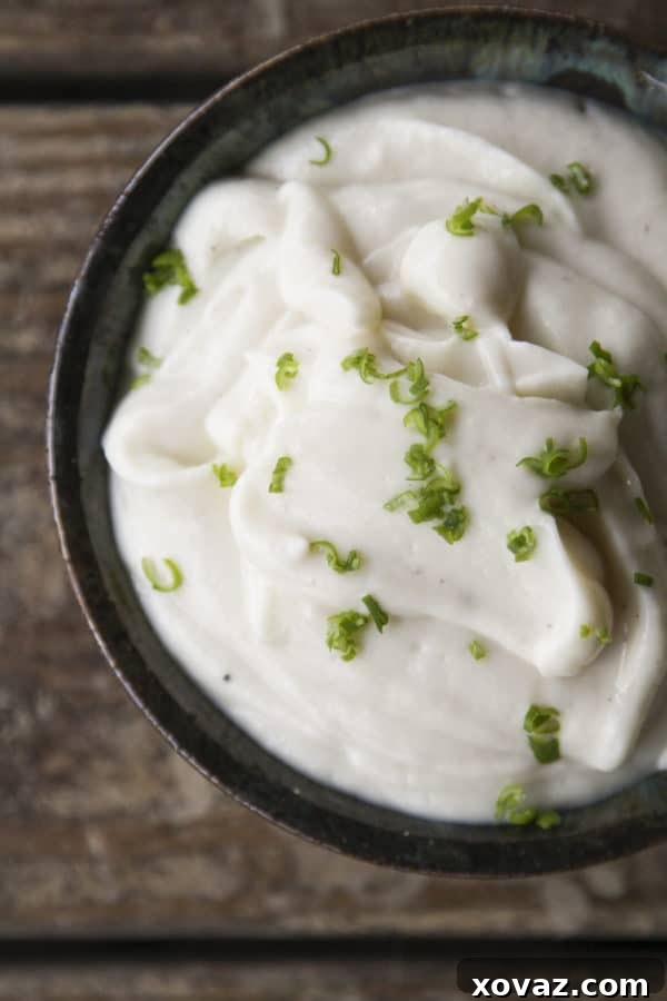 Creamy Cauliflower Delight 4 Close-up of the Silky, creamy Roasted Garlic Cauliflower Puree, showing its smooth texture, ready to be served as a delightful side dish for any meal.