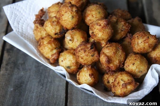 Golden Jalapeno Cheese Poppers 3 Close-up of golden Cheesy Jalapeno Potato Poppers, showing crispy texture and melted cheese inside