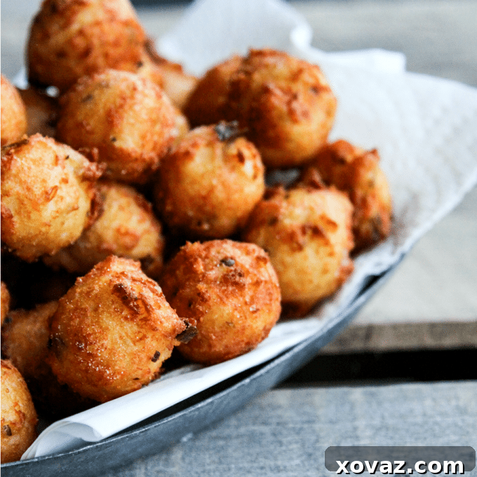 Golden Jalapeno Cheese Poppers 5 Cheesy, deep-fried Jalapeno Potato Poppers on a serving platter, a perfect appetizer