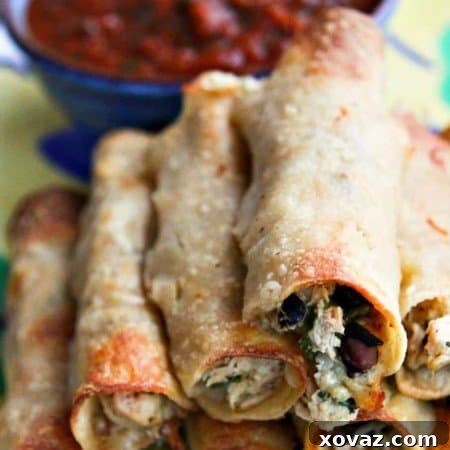 Baked Cheesy Chicken and Bean Taquitos from foodiewithfamily.com