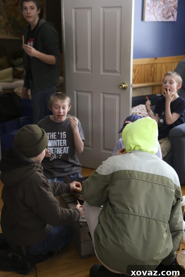 Eager children's hands reaching into a bowl of Honey Sriracha Glazed Chicken Bites