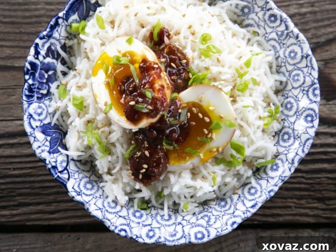 Val's Soy Sauce Eggs served with congee and other Asian-inspired side dishes.
