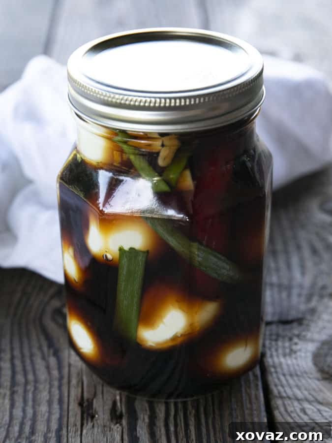 A close-up of beautifully marinated Soy Sauce Eggs, showcasing their rich color and jammy yolks, ready for serving.