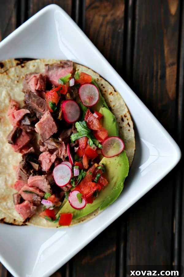 Sizzling Carne Asada Tacos 3 Close-up of perfectly grilled Carne Asada steak, ready to be sliced for tacos