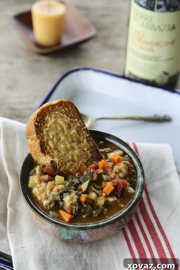 Hearty Ribollita Tuscan Vegetable Bean Soup, a staple of Italian cucina povera, on a rustic table, inviting warmth and comfort.