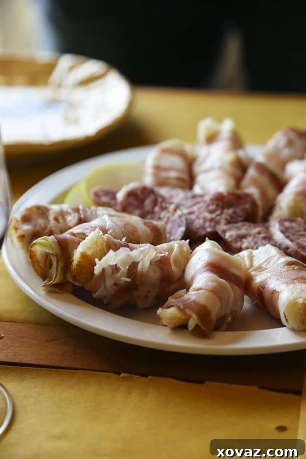 A vibrant spread of Italian delicacies, including fresh fruits and cured meats, prepared for lunch.