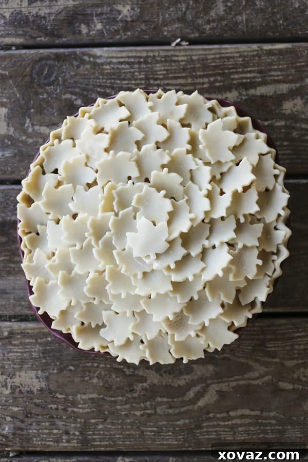 Chai-Spiced Maple Apple Pie 2 Exquisite Maple Chai Apple Pie with a beautifully tiled crust, showcasing a creamy, rich, and chai-spiced apple filling.