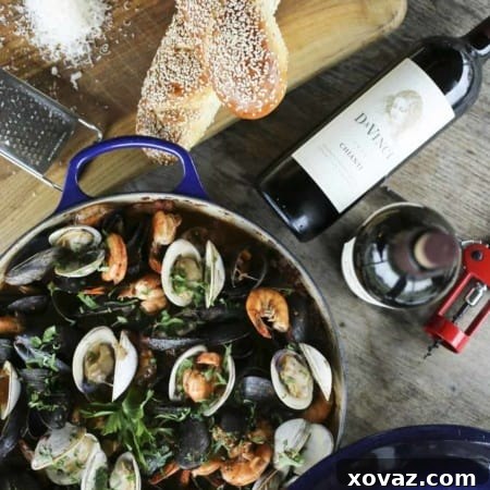 A beautiful bowl of homemade Cioppino - Italian Seafood Stew, garnished with fresh herbs, ready to be served.