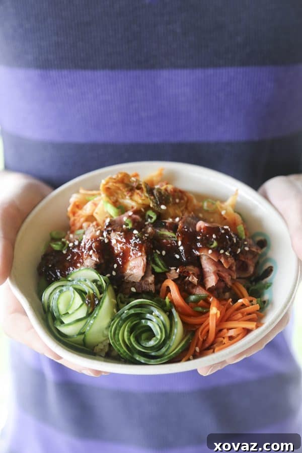 Fragrant, garlicky, simple, and fast Korean BBQ Steak Rice Bowls for a speedy dinner win! A close-up of a beautifully arranged Korean BBQ Steak Rice Bowl with tender steak, vibrant vegetables, and sticky rice.