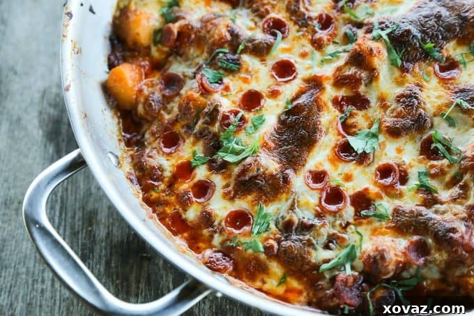 Pepperoni Pizza Gnocchi Bake 2 Pillowy gnocchi sautéed in garlic butter, mixed with rich pizza sauce and pepperoni, then baked with melted mozzarella and fresh parsley, creating a braces-friendly pizza experience.