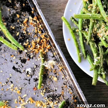 Garlic Parmesan Green Beans: Simple roasted green beans irresistibly coated in crispy garlic, parmesan breadcrumbs.
