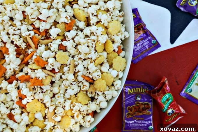 The Ultimate Cheddar Lover's Popcorn Snack Mix is full of cheddar popcorn, two kinds of cheddar crackers, cheddar puffs, and boxed cheddar snack mix. This is sure to banish those after-school snack attacks with style!