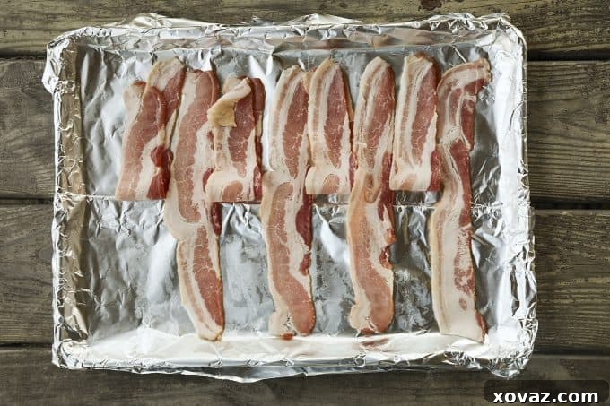 Detailed step for the bacon weave: Slices 1, 3, 5, and 7 are folded back halfway to prepare for the first cross-wise bacon strip, essential for a sturdy Low-Carb Bacon Bun Swiss Burger.