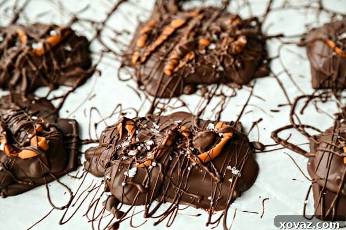 Gourmet Caramel Stuffed Dark Chocolate Covered Pretzels with a sprinkle of sea salt, showcasing the gooey caramel center