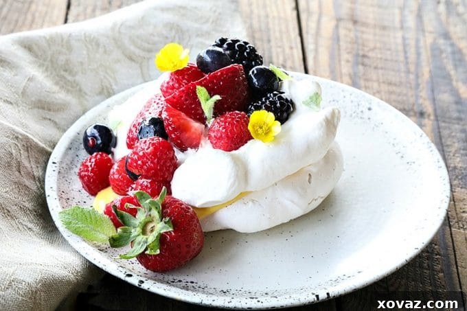 Ethereally light, crisp on the outside, marshmallowy on the inside, this Mini Pavlova Recipe is foolproof and ready for summer!