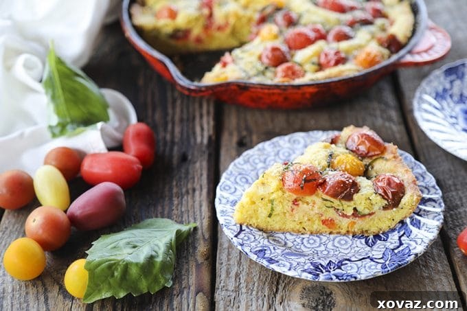 Delicious Savoury Parmesan Basil Tomato Cake garnished with fresh basil leaves.