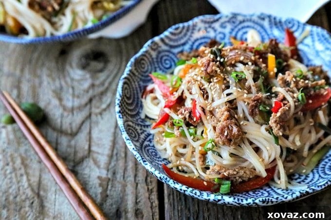 Easy Garlic Ginger Crispy Pork Noodles are going to be your new favourite dinner. Crazy simple. Crazier delicious. And easy on your pocketbook to boot. This delicious meal-in-one whips up in less than 30 minutes.