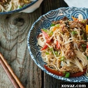 Easy Garlic Ginger Crispy Pork Noodles, a quick and delicious dinner ready in under 30 minutes.
