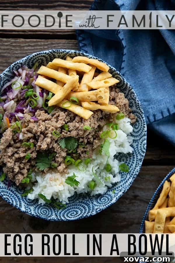 A close-up shot of the vibrant Egg Roll In A Bowl, showcasing the colorful vegetables and seasoned pork.
