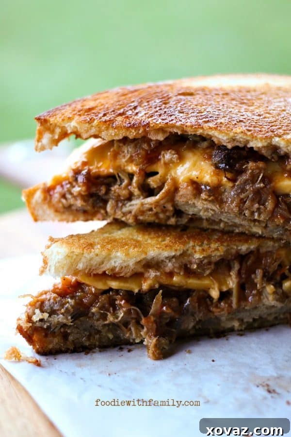 Hearty Barbecue Pulled Pork and Toasted Cheese Sandwiches with crunchy pickles.