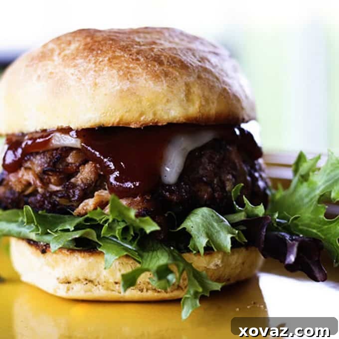 Filthy Burgers: Beef burgers topped with generous amounts of pulled pork and crispy bacon.