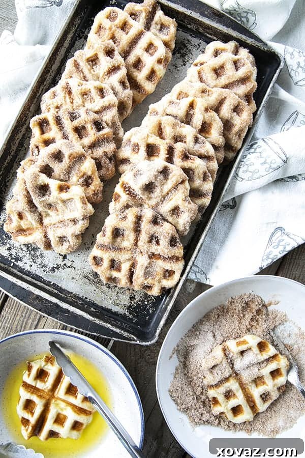 Crispy edged, cinnamon-sugar dusted Churros Waffles are 100% irresistible and ridiculously easy to make, taking advantage of frozen dough for the base. Bonus: No boiling oil!