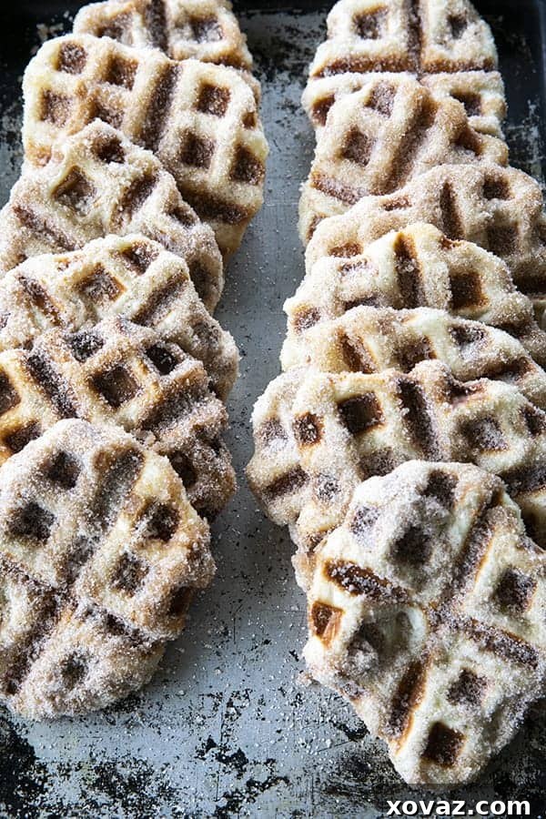 Crispy edged, cinnamon-sugar dusted Churros Waffles are 100% irresistible and ridiculously easy to make, taking advantage of frozen dough for the base. Bonus: No boiling oil!