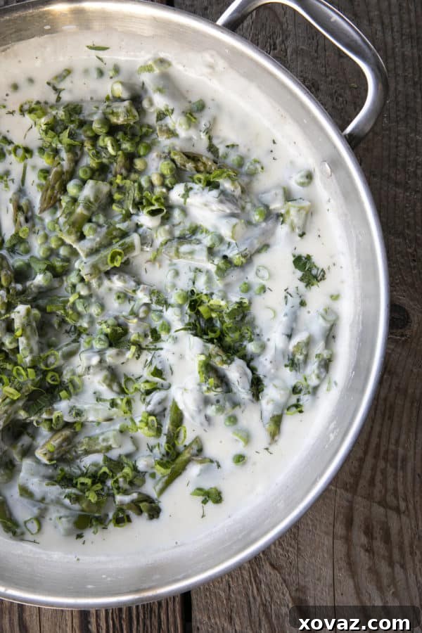 Lush Creamed Asparagus and Peas 4 Tender spring peas and asparagus combine in a garden herb cream sauce in this new-fashioned take on delightfully old-fashioned Creamed Peas. Served over toast, this is one simple, economical dish wows!