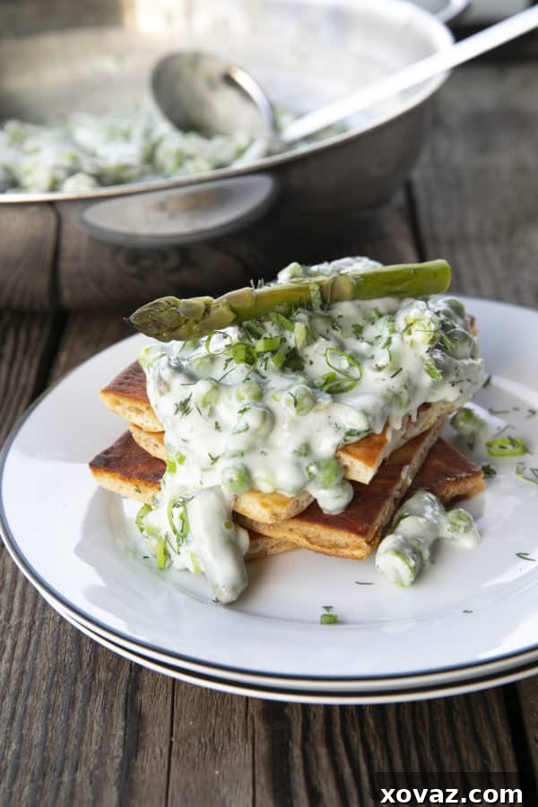 Lush Creamed Asparagus and Peas 5 Tender spring peas and asparagus combine in a garden herb cream sauce in this new-fashioned take on delightfully old-fashioned Creamed Peas. Served over toast, this is one simple, economical dish wows!