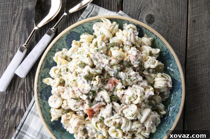 Zesty Salmon Pasta Salad 8 The creamy dill dressing for Smoked Salmon Pasta Salad being whisked in a bowl.