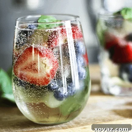 Sangria-by-the-glass makes it so you don't need to whip up a whole pitcher to enjoy Sangria! Sparkly, slightly sweet, berry-and-basil fresh!