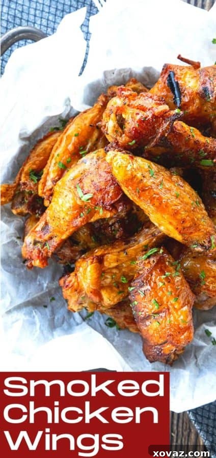 Smoky Crispy Chicken Wings 8 A platter of crispy smoked chicken wings garnished with fresh herbs, ready for a gathering.