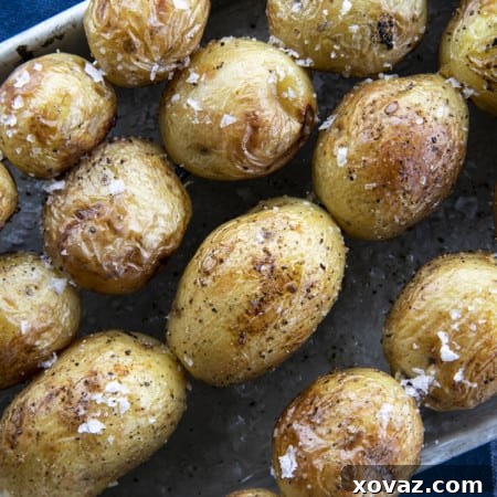 A vibrant close-up of perfectly grilled potatoes, showcasing their golden-brown char and inviting texture.