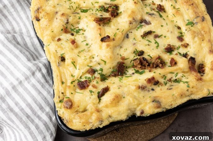 Peeled and diced potatoes boiling in a large pot, ready for mashing.