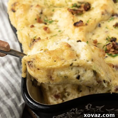 A square image of the finished Twice Baked Mashed Potatoes casserole with a golden, crispy crust.