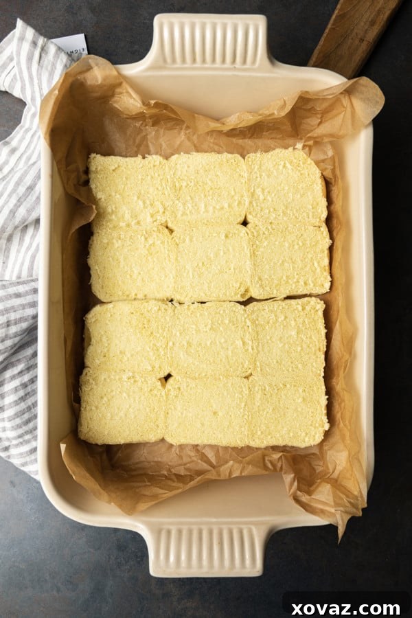 Smoky Pulled Pork Mini Sandwiches 6 Bottom half of slider rolls neatly arranged in a baking pan.