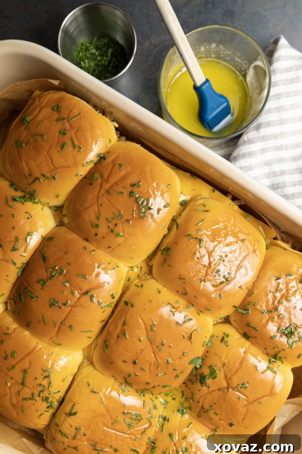 Smoky Pulled Pork Mini Sandwiches 7 Baked pulled pork sliders, golden brown and melty, fresh from the oven.