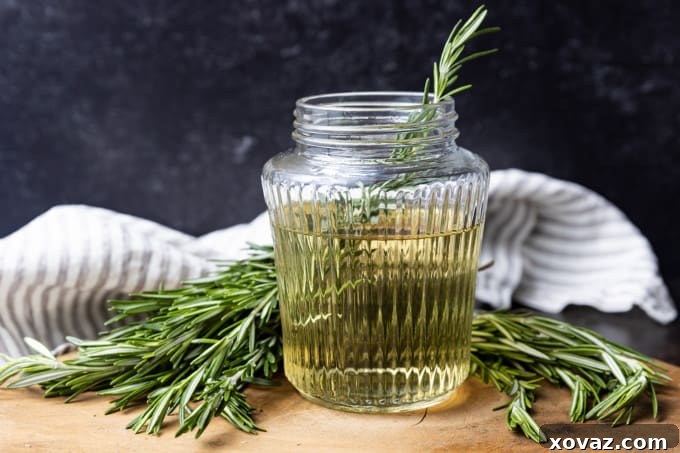 Rosemary Infused Syrup 3 A visually appealing shot of freshly prepared rosemary simple syrup in a glass jar, ready for use.