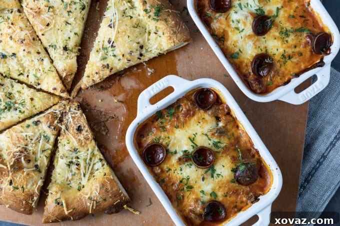 Bubbly and cheesy pizza bowls fresh from the oven, showcasing melted mozzarella, crispy pepperoni, and rich marinara sauce, ready to be enjoyed as a comforting dinner.