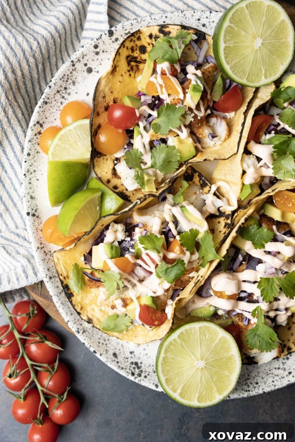 Freshly cooked Air Fryer Fish Tacos with a squeeze of lime