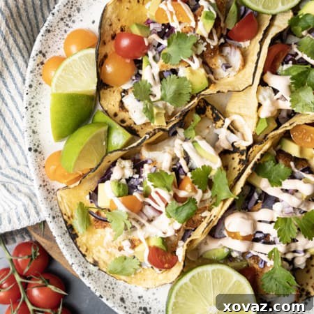 Taco seasoning rubbed cod is the star of these lightning fast, terrifically easy Air Fryer Fish Tacos. Done in about 15 minutes from start to finish these fish tacos are going to be a new favourite busy weeknight meal!