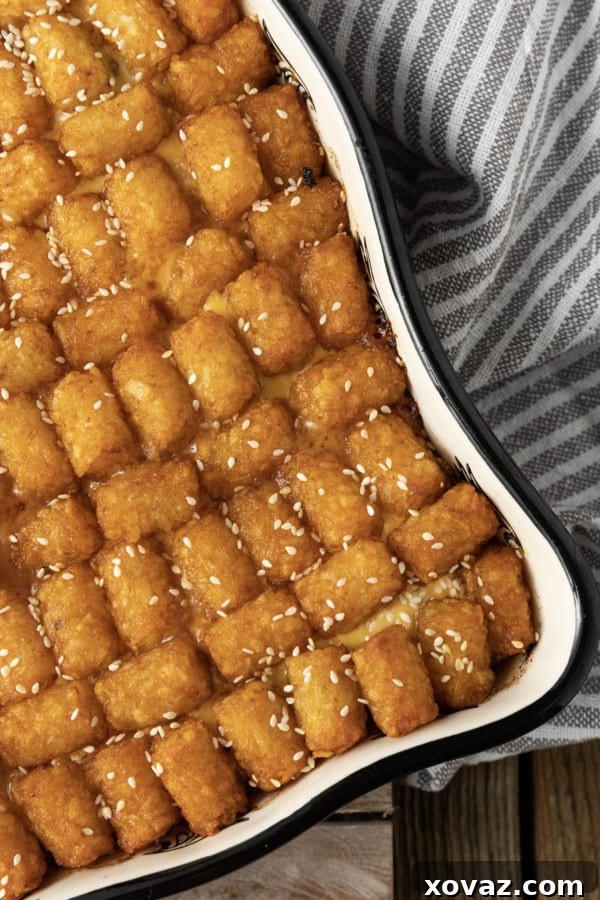 Ingredients laid out for Big Mac Tater Tot Casserole, including ground beef, cheese, tater tots, and various sauce components.