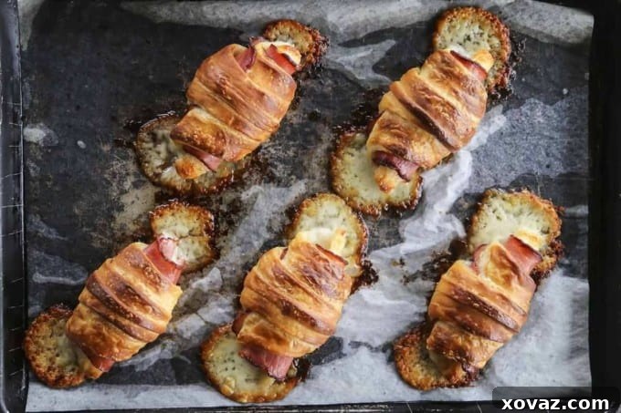 A selection of delicious breakfast foods, including flaky ham and cheese croissants and savory muffins, perfect accompaniments to a hearty breakfast pizza.