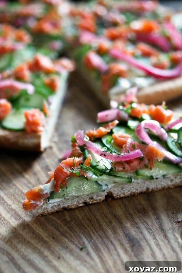 A gourmet pizza topped with smoked salmon, dill, and capers, offering a sophisticated twist.